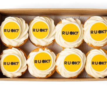 Eight cupcakes with RU OK? images on the top